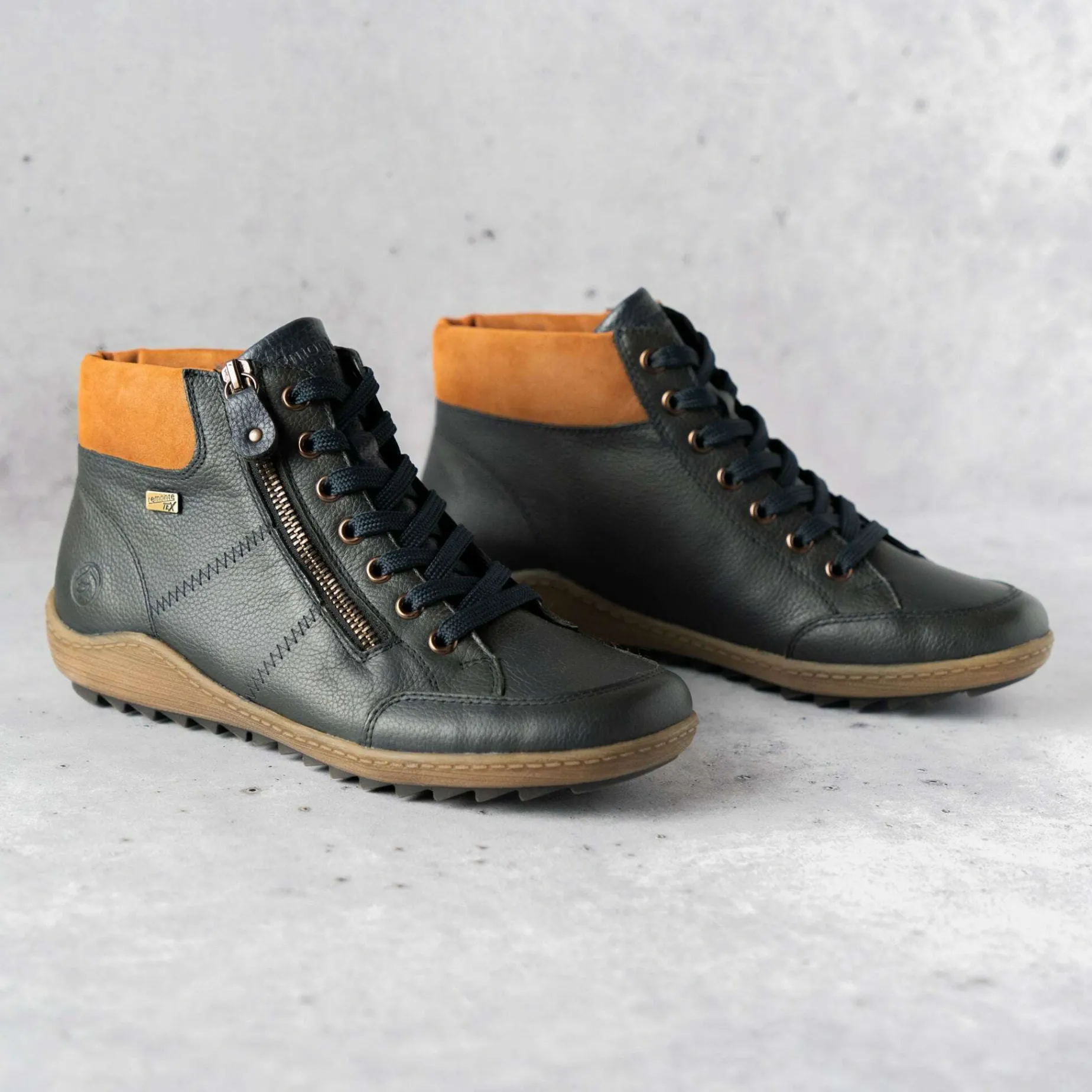 remonte_r_waterproof_snea_0.webp REMONTE R1457-14 Waterproof Sneaker in Navy Leather with Brown accent