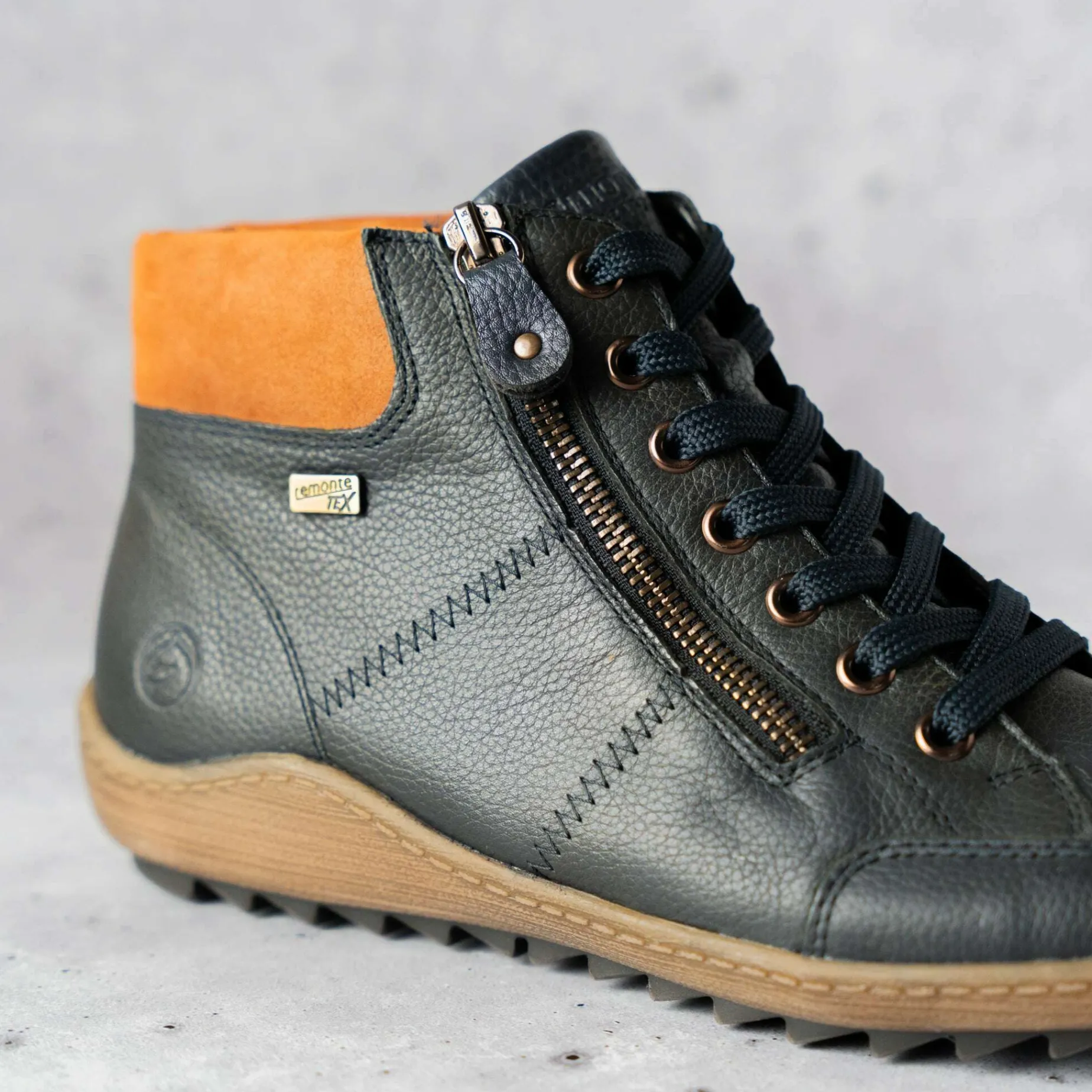 remonte_r_waterproof_snea_1.webp REMONTE R1457-14 Waterproof Sneaker in Navy Leather with Brown accent